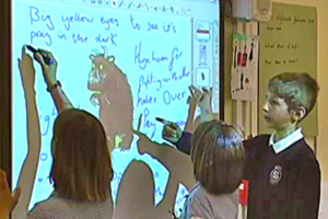 School students at interactive whiteboard